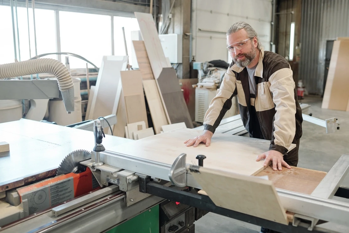 Furniture maker working at a panel saw